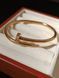 Cartier Браслет-гвоздь женский из медицинской стали золотистый с фианитами 7029 фото 6