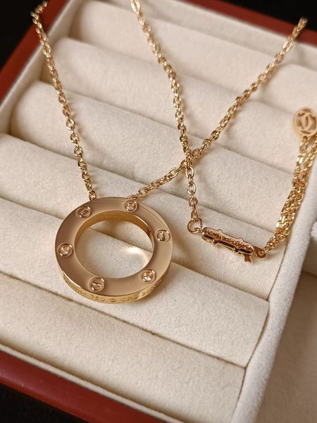 Cartier Кольє жіноче із медичної сталі золотисте з круглою підвіскою Love 8012 фото