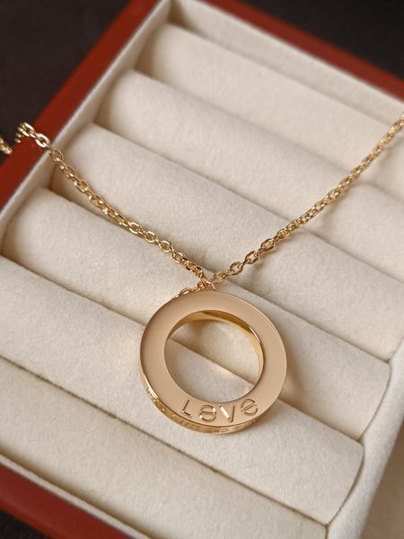 Cartier Кольє жіноче із медичної сталі золотисте з круглою підвіскою Love 8012 фото