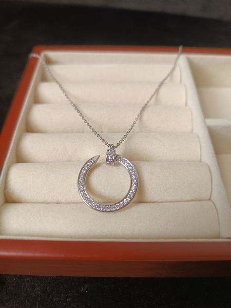 Cartier Колье женское из медицинской стали серебристое с подвеской-кольцом гвоздь 8013 фото