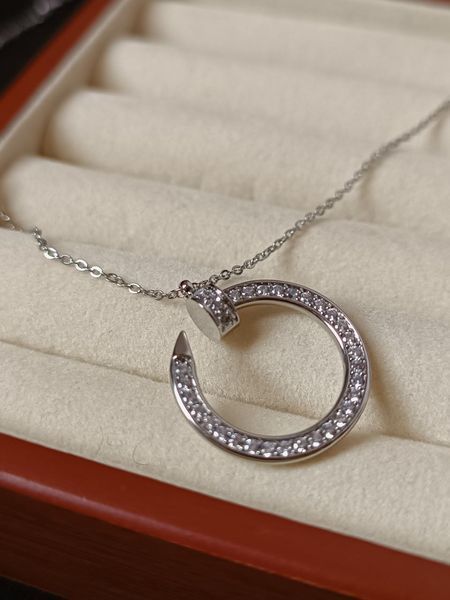 Cartier Колье женское из медицинской стали серебристое с подвеской-кольцом гвоздь 8013 фото