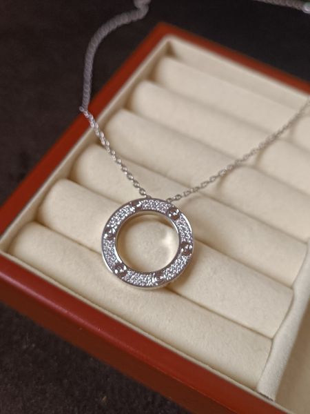 Cartier Колье женское из медицинской стали серебристое с кулоном-кольцом и камнями 8009 фото