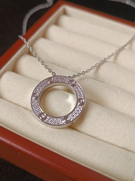 Cartier Колье женское из медицинской стали серебристое с кулоном-кольцом и камнями 8009 фото