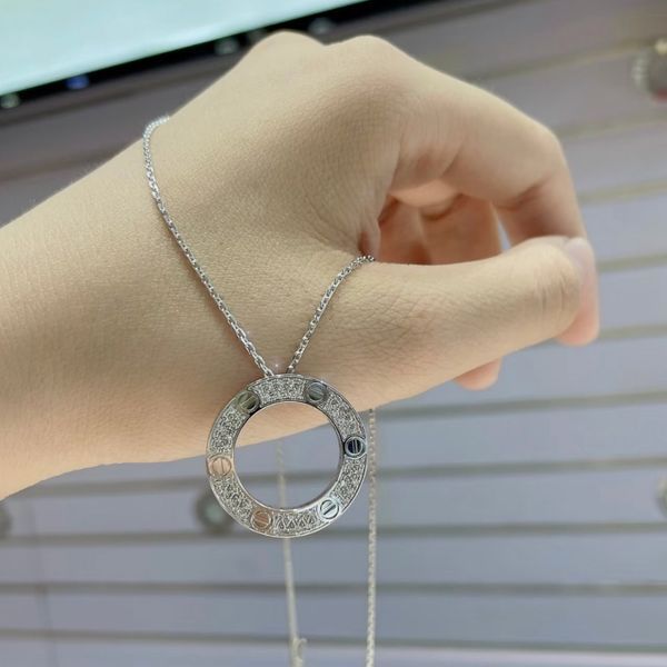Cartier Колье женское из медицинской стали серебристое с кулоном-кольцом и камнями 8009 фото